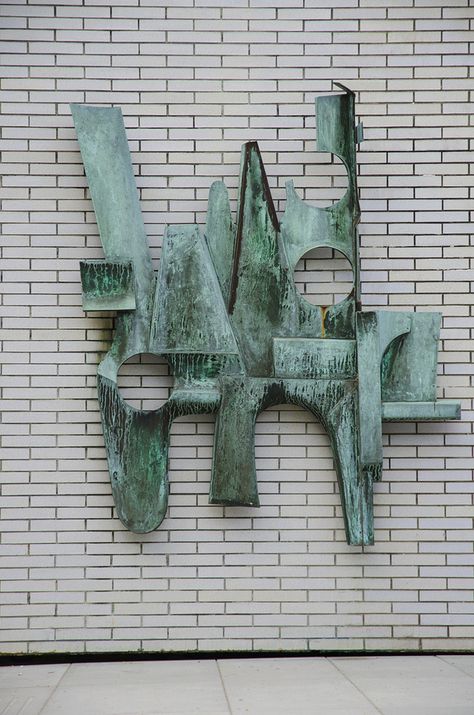 Sculpture, Configuration (1960) by Gerhard Class. Located on the exterior wall of the Buchanan Building entrance, this sculpture was the winner of a Canada Council contest in 1958. It was a bequest to UBC. The patina on the surface is the result of weathering. It is made of welded and soldered sheet copper. In September 2013, Gerry McGeough, the University o... Mid Century Sculpture Art, Sculpture On Wall, Ubc Campus, Exterior Wall Art, Mid Century Sculpture, Copper T, Copper Sculpture, Deconstructivism, Building Entrance