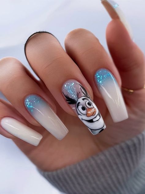 A fun and frosty nail design with an icy ombre effect and glitter accents, featuring Olaf from Frozen on the ring finger. The combination of blue hues and white tips adds a whimsical, wintry touch, perfect for Disney lovers and those wanting a playful winter look. Frozen Nail Designs, White Christmas Nail Ideas, Olaf Nails, Disney Frozen Nails, Trendy Acrylic Nails, Frozen Nails, Christmas Nail Ideas, Short Square Nails, Christmas Nail