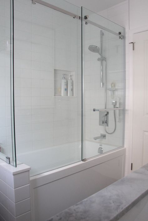 Frameless glass shower.  Pony wall.  Sliding door. Sliding Glass Shower Door Bath Tubs, Shower Pony Wall, Glass Tub Enclosure, Bathtub With Glass Door, Half Wall Shower, Glass Bathtub, Tub To Shower Remodel, Shower Cabinets, Bathtub Shower Combo