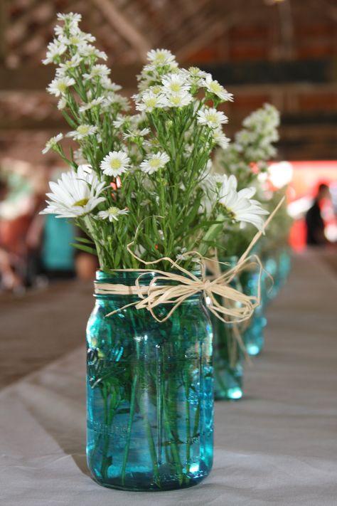 I wanted the original blue antique Mason jars for this table setting, but they were too expensive.  I used blue glass paint on clear Mason jars to get the look. Blue Mason Jar Centerpieces For Weddings, Memorial Service Decorations, Blue Carnations, Rustic Bohemian Wedding, Hanging Mason Jars, Blue Mason Jars, Mason Jar Flowers, Carnation Flower, Mason Jar Centerpieces