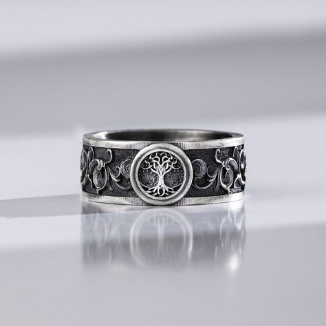 The Tree of Life Ring honors the connection between nature and life. The Tree of Life, Yggdrasil is a mythical tree that was central in Norse mythology, believed to be the path between the 9 worlds. This ring shows a symbolic Celtic band with a modern touch and cool style, perfect for men and women alike. The this engraved band ring is made of high quality sterling silver reflects its vitality! As a gift for your spouse or fiance, an engagement ring will be treasured forever as a symbol of commi Mens Wedding Bands With Trees, Medieval Rings Men, Celtic Rings For Men, Male Engagement Ring Men, Male Ring Design For Men, Wedding Rings For Men Unique, Men’s Rings, Wedding Rings Male, Viking Rings For Men