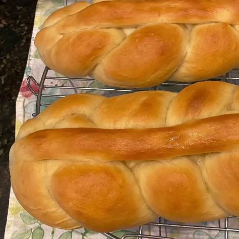 a hand kneaded white bread that is soft and buttery. It is perfect for stews and pairs nicely with Pepperpot. Plait bread is a type of braided bread (plait, meaning to braid or interweave) and is the most popular bread in Guyanese cuisine. It can be eaten for breakfast with various spreads, dipped in tea, toasted with butter, and completes a wonderful pepperpot meal on Christmas morning. Guyanese plait bread is white bread that isn’t too light or too dense. It’s sturdy enough to dipping in warm Guyanese Bread Recipe, Plaited Bread Recipe, Plait Bread, Braided Bread, White Bread, Christmas Morning, Bread Recipe, Sheet Pan, Yeast