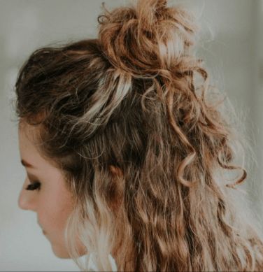 35 Best Half-Up Bun Hairstyles That Don't Look Messy | YourTango Half Up Bun Curly Hair, Half Up Half Down Bun Curly Hair, Half Up Curly Hairstyles, Curly Hair Bun Styles, Messy Bun Curly Hair, Half Bun Hairstyle, Half Up Curly Hair, Half French Braids, Curly Hair Half Up Half Down