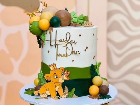 “King of the jungle, just chilling on my throne" 🌿👑 . . . . Concept & Styling: @kulsoom.motiwala Execution: @blissfulfusionevents Cutouts/Supplies: @blissfuldreamscreations Graphic Design: @creativefusionstudiospk Cake: @cakemartt Whatsapp: 0311-2985551 "Life's too Short to have Boring Parties" #simbatheme #lionkingtheme #simbaparty #lionkingparty #festasimba #festalionking #lionkingbirthday #simbabirthday #simba #lionking #mufasa - #blissfulfusionevents - #eventprofs - #eventplanner - #ev... Simba Cake Ideas, Simba Lion King Cake, Lion King Baby Shower Cake, Simba Cake, Lion King Cake, Cake Children, Half Birthday Cakes, Lion King Theme, Baby Boy Birthday Cake