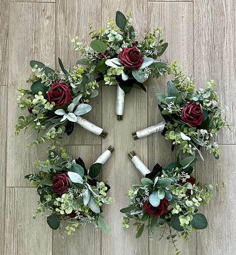 "Boho bridesmaids bouquets burgundy rose greenery bridal bouquet eucalyptus wedding bouquet, Lambs ear sage wine merlot bridesmaid flowers 🌿As Shown; Bridal 11-12\" 6 roses and heavy greenery  🌿 5 Bridesmaid 8\" 3 roses & greenery (shown) ( pictured are a set of 5 bridesmaids stem wrap is burlap)  If you would like a different color rose in the bouquets choose from color options shown in the photograph I added, just let me know in the personalization box. Only one color per item because the br Burgundy White Greenery Wedding, Simple Bridesmaid Bouquets Burgundy, Burgundy Flower Bouquet Bridesmaids, Olive Green And Wine Red Wedding, Burgundy Eucalyptus Bouquet, Wine Colored Wedding Flowers, Wine Red Wedding Bouquet, Wine Color Bouquet, Maroon Pink And Green Wedding