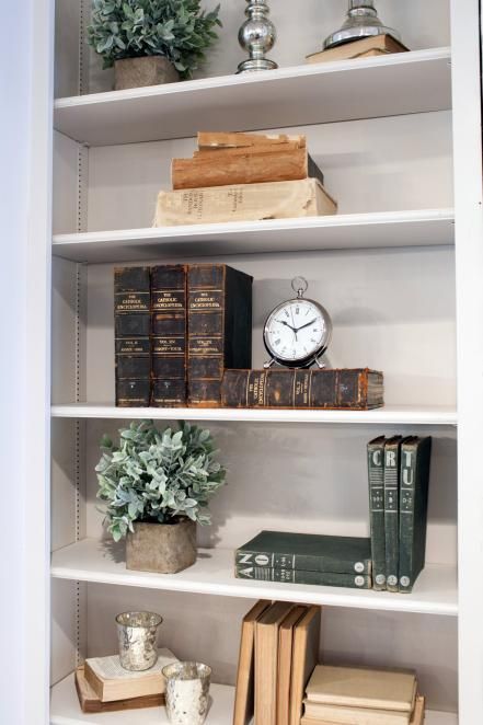 As seen on Fixer Upper, antique books are used as decor on the living room's bookshelf in the Reed's newly remodeled home. Billy Ikea, Stick Decor, Bookshelves In Living Room, French Country Living Room, Bookcase Decor, Farmhouse Shelves, Asian Homes, Asian Home Decor, Bookshelf Styling