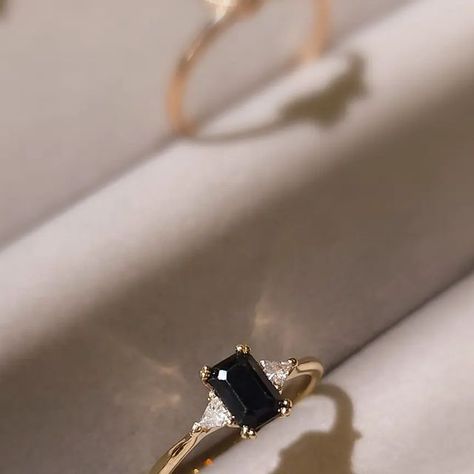 LOREAN on Instagram: "Emerald cut black sapphire flanked by triangle cut moissanite set in gold.  This one-off ring is available 🖤 More info at info@lorean.co.za   #loreanjewellery" Black Emerald Engagement Ring, Black Sapphire, February 13, Emerald Engagement, Fashion Wishlist, Emerald Engagement Ring, Emerald Cut, Engagement Ring, Emerald