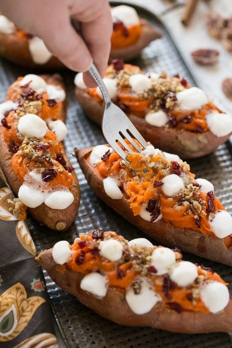 These loaded twice baked sweet potatoes are piled high with pecan brown sugar streusel, marshmallows and dried cranberries. You can prepare them in advance and then pop them in the oven right before your holiday meal! Sweet Potato Dinner, Twice Baked Sweet Potatoes, Sweet Potato Recipes Baked, Baked Sweet Potatoes, Potato Dinner, Twice Baked, Twice Baked Potatoes, Cornbread Dressing, Baked Sweet Potato