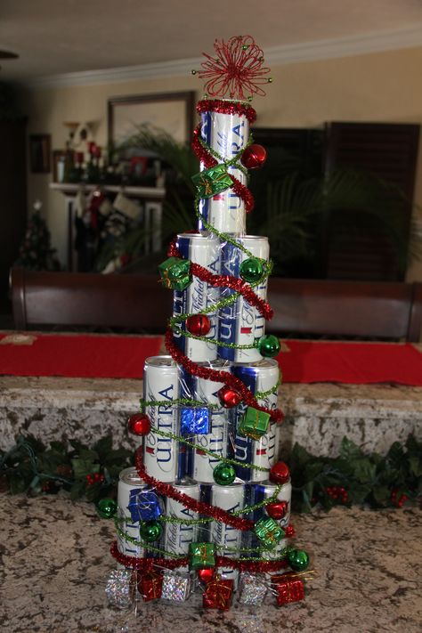 I created this Christmas Tree out of full cans of beer for a friend of mine.  I used clear packing tape and decorated it.  She loved it! The sky is the limit on ideas!  Can't wait to see what everyone can create!  Great man gift for XMas and attach lottery tix, favorite candy, gift cards, etc! Beer Can Christmas Tree, Can Christmas Tree, Decorated Trees, Bangs Ideas, Haircut 2022, Christmas Tree With Presents, Easy Diy Christmas Gifts, Pixie Cut With Bangs, Tree Themes