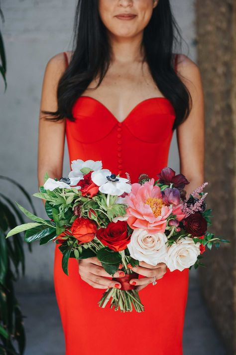 Roses and anemones made up the majority of this leafy bunch—and looked stunning against the holder's buttoned-up crimson dress. Red Bridesmaid Dress, Colourful Bouquet, Anemone Bouquet, Simple Spaghetti, Red Anemone, Red Bridesmaid, Red Prom Dresses, White Anemone, Bridesmaid Bouquets