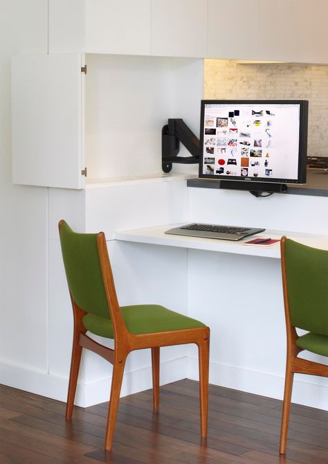 A computer monitor is hidden within the kitchen cabinets, creating a small home office. Hidden Home Office, Kitchen Trends 2020, Top Kitchen Trends, Live Edge Desk, Kitchen Peninsula, Small Computer Desk, Hidden Kitchen, English Kitchens, Small Home Office