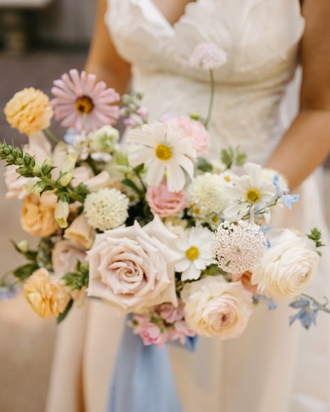 She deserves a permanent spot on the feed 😍 B’s bridal bouquet was full of summer’s best blooms Dawn creek zinnias Cosmos Blush didiscus (a new fav!) Creamy foxglove Banana scoops Peachy ranunculus Bella Donna delphinium Flowers sourced from only the best @freckledflowerfarms @thefarmerflorist_ @foliageflowerfarm @goldenseasonflowerco @sjflowercollective @torchionursery The dreamiest bow made by the bride herself 🩵 @stitchandstuffs Delphinium Flowers, Delphinium, Ranunculus, How To Make Bows, Bridal Bouquet, Cosmos, The Bride, Blush, Flowers