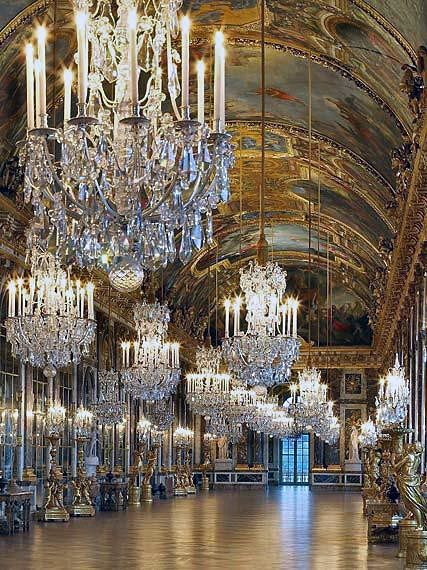 Chandeliers at Palace of Versailles's Hall of Mirrors.   In the 1670s Louis XIV built the Grand Apartments of the King and Queen, whose most emblematic achievement is the Hall of Mirrors designed by Mansart, where the king put on his most ostentatious display of royal power in order to impress visitors. The Chapel and Opera were built in the next century under Louis XV. Versailles Hall Of Mirrors, Chateau Versailles, Hall Of Mirrors, Palace Of Versailles, Chateau France, Louis Xiv, The Ceiling, Ancient Architecture, Alam Yang Indah