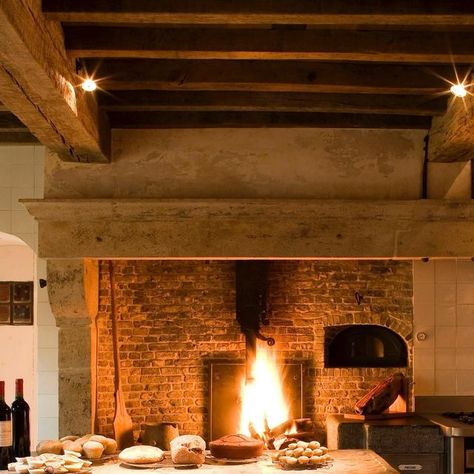 Joris Van Apers Studio on Instagram: "Throwback to a country kitchen. The fire is still burning. 17th-century mantelpiece with a combination of cooking stove, fireplace with grill & integrated bread oven. Kitchen island crafted from recycled drawers with a countertop from an original hunting table. Reclaimed terracotta tiles.  @jopauwelsphotography   #jorisvanapersstudio #interiorarchitecture #architectureinteriors #architectureinterieure #countrylife #countrykitchen #craftsmanship #naturalmaterials #countryliving #reclaimedfurniture #reclaimed #upcycledfurniture #cuisinecampagne #kitchendesign #kitchenrenovation" Cooking Fireplace, Terracotta Fireplace, Fireplace Kitchen, Fireplace Cooking, Island Crafts, Bread Oven, Cooking Stove, Reclaimed Furniture, Kitchen Fireplace