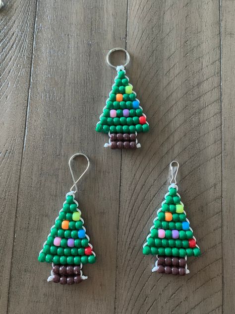 Get into the holiday spirit with these festive Christmas Tree Pony Bead Keychains. Great for book bags, keys, or even as an ornament for your tree.  Measures: 4.5 in x 2 in Pony Beads Christmas Ornaments, Christmas Beaded Keychain, Pony Bead Christmas Tree, Pony Bead Ornaments In Oven, Simple Pony Bead Patterns, Seed Bead Patterns Christmas, Pony Bead Food Patterns, Christmas Beaded Keychains, Pony Bead Christmas Crafts