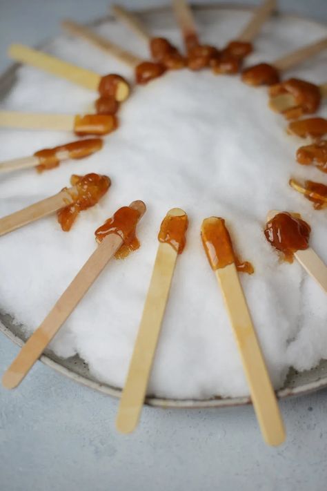 A tradition in the Northeast and Canada during maple sugaring season, maple syrup taffy on snow is a sweet winter treat that everyone loves! | fareisle.com Maple Taffy, Taffy Recipe, Winter Homeschool, Snow Recipe, Maple Sugaring, Nutcracker Party, Maple Candy, Snow Party, Winter Treats