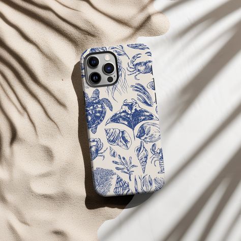 Immerse yourself in the coastal charm of our Sea Animal Pattern Rustic Blue Phone Case, designed to embody the serene beachy vibes of the Coastal Grandma aesthetic. This delightful iPhone case, adorned with intricate sea animal patterns, brings a touch of tropical elegance to your device. Crafted with meticulous attention to detail, it's not just a phone case, but a statement piece that reflects your unique style. Compatible with iPhone 12-15 Pro Max, 12-15 Pro, and 14-15 Plus. Made with high-qu Beachy Phone Case, Coastal Grandma Aesthetic, Beach Phone Case, Grandma Aesthetic, Blue Iphone Case, Blue Phone Case, Beachy Vibes, Blue Iphone, Rustic Blue