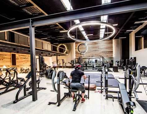 The timber plank finish to walls really compliments the black metal work and industrial ceiling features in this gym fit-out. Factory refurbishment at it's best. | Architecture | style | loft | light | lighting | rustic | commercial | design | timber | black | ceiling | fitness | wood | inspiration | contemporary | workout | spaces | beam | column | Warehouse Gym Design Industrial Style, Personal Gym Design, Clubs Interior Design, Industrial Gym Design, Gym Ideas Design Commercial, Warehouse Gym Design, Personal Training Studio Design, Commercial Design Retail, Industrial Gym