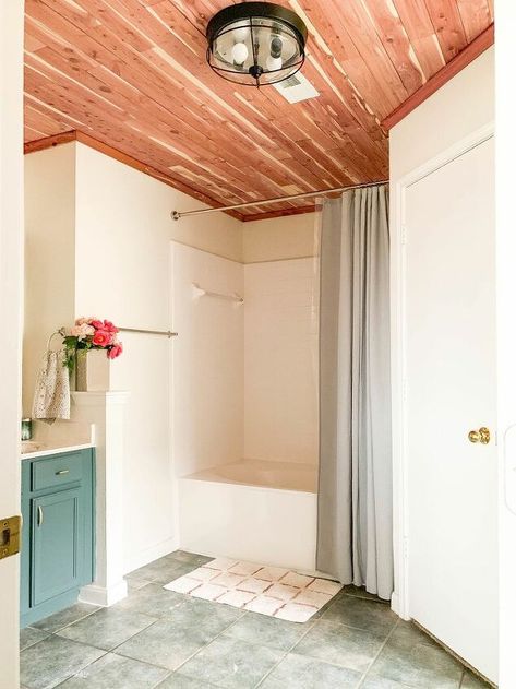 I get so many questions about our cedar-lined ceiling - this is the second time we've done this project, and I wanted to share the finished results and a few thoughts! If you love this idea, you can find more easy and affordable DIY ideas for the home on my blog, Love & Renovations. Cedar Bathroom, Cedar Ceiling, Ceiling Bathroom, Painting Tile Floors, Plank Ceiling, Luxury Vinyl Tile Flooring, Cedar Planks, Diy Dining Table, Bathroom Ceiling