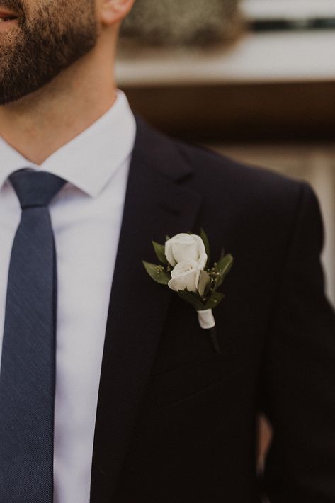 Grooms Boutonnieres. White flowers. Greenery. Groomsmen. Simple boutonnières. Elegant wedding. Navy blue groomsmen. Navy Blue Groomsmen, Boutineer Wedding, White Rose Boutonniere, Romans 8 39, Blue Groomsmen, Olathe Kansas, White Boutonniere, Button Holes Wedding, Groomsmen Boutonniere