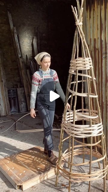 Charlotte on Instagram: "Every year I harvest hazel to build plant supports 🌳 This year I thought I’d try something different by weaving ash splints (the ones harvested in my last reel) through the poles, rather than working with more hazel.  This has given me a chance to get a feel for the ash before working on more intricate weaving projects. The splints were soaked before use to increase flexibility.   When the garden is still looking pretty bare, there is something really reassuring and uplifting about busying myself in preparation for what is to come. Harvesting canes and brush; building structures and supports; mulching pathways - all become creative acts in building form. Like preparing the future homes for the flowers and edibles that are just coming to life in the greenhouse 🌱🌼 Become Creative, Harvest Art, Garden Plant Supports, Twig Crafts, Twig Art, Garden Poles, Willow Weaving, The Greenhouse, Increase Flexibility