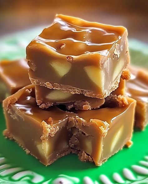 Caramel Apple Fudge Delight 🍏🍬 This decadent dessert combines the flavors of caramel and apple in a creamy, fudge-like treat that’s perfect for fall or any sweet occasion! Ingredients: 2 cups granulated sugar ½ cup unsalted butter ½ cup heavy cream 1 cup chopped apple (peeled and cored) 1 cup caramel sauce (store-bought or homemade) 1 teaspoon vanilla extract 1 ½ cups white chocolate chips ¼ teaspoon salt ½ cup chopped nuts (optional, for topping) Instructions: Line an 8x8-inch baking pan... Caramel Apple Fudge, Apple Fudge, Creamy Fudge, Decadent Food, Caramel Fudge, Dessert Bites, Candy Thermometer, Fudge Sauce, Quick Desserts