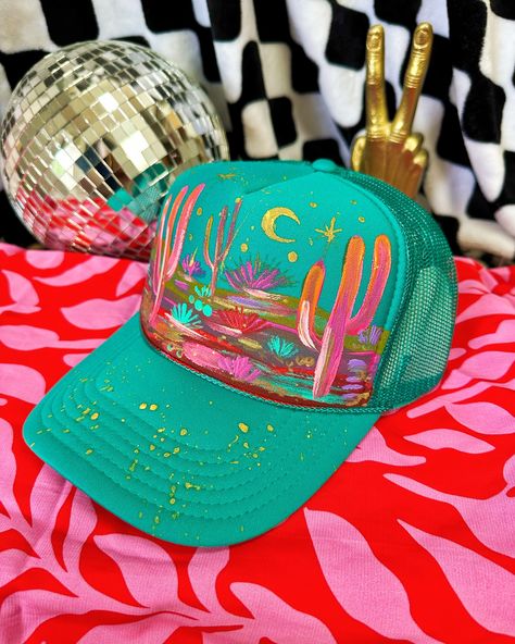 Over 30 new hand painted hats just went live! 🔥 Florals fedoras marked $65 OFF and hand painted desert trucker hats!! Woohoo! 💖 these are sooooo cool and beautiful! I was listening to @radvxz while I made these because right now that’s all I can listen too! 😭 I’m kinda obsessed with her music! #truckerhat #truckerhats #hatbar #cowgirlstyle #cowgirlfashion Hand Painted Gift Ideas, Painted Trucker Hats, Hand Painted Hats, Textured Hat, Diy Hats, Craft Fair Booth Display, Custom Cowboy Hats, Hat Bar, Obsessed With Her