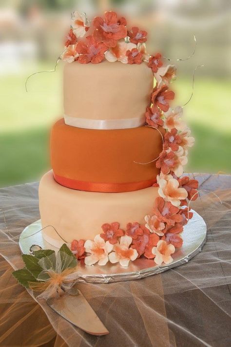 Burnt Orange and ivory wedding cake Orange And White Wedding Dress, Sweet 16 Orange Theme, Orange Quinceanera Theme, Orange And Ivory Wedding, Burnt Orange Wedding Cake, Orange Color Cake, Orange Quinceanera, Wedding Cake Elegant Gold, Hampton Wedding