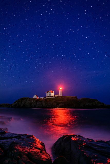 ~~Night at Nubble Lighthouse | red fresnet reflects off the water and rocks under the stars, Cape Neddick, Maine by Mike Blanchette~~ Lighthouse Night, Cape Neddick Maine, Lighthouse At Night, Nubble Lighthouse, Maine Lighthouses, Lighthouse Photos, Boat Lights, Maine Vacation, Lighthouse Pictures