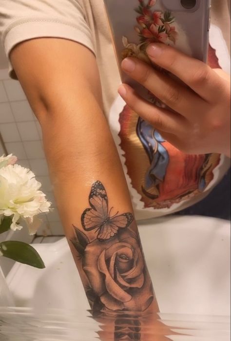 got this beautiful piece done on my forearm paired with a butterfly Butterfly Forearm Tattoo Women, Forearm Tats For Women, Butterfly Tattoo Forearm, Butterfly Forearm Tattoo, Baddie Tattoos, 2024 Tattoo, Rose Tattoo Forearm, Butterfly Hand Tattoo, Rose Tattoo Sleeve