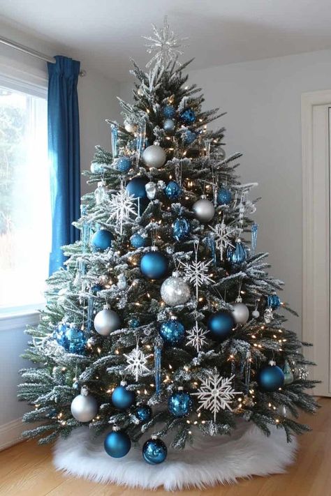 Snowflake Theme Tree, Fantasy Themed Christmas Tree, White Silver And Blue Christmas Decor, White Silver And Blue Christmas Tree, Snow Theme Christmas Tree, Winterwonder Land Christmas Tree, Dining Room Decor For Christmas, Christmas Decorations Blue And Silver, Snow Themed Christmas Decor