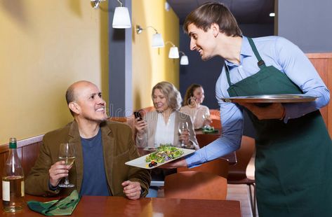 Waiter serving senior male customer in cafe. Happy waiter serving senior male cu #Sponsored , #paid, #PAID, #senior, #Waiter, #waiter, #male Waiter Serving Food, Elegant Cocktails, Small Towns, Photo Image, Cafe, Stock Photos, Quick Saves