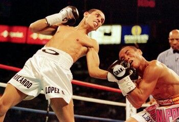 Ricardo "Finito" Lopez lands an uppercut. One of the greatest boxers of all time, he retired with an undefeated record of 51-0-1(38 ko's). Boxing History, Mixed Martial Arts, Human Figure, All Time, Martial Arts, Boxing, Dragon Ball, Sumo Wrestling, Wrestling