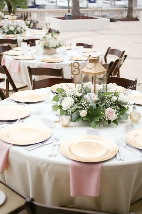 Simple centerpieces are perfect for round tables. #WeddingInspo Round Table Centerpieces Wedding, Round Table Settings, Round Table Centerpieces, Round Wedding Tables, Pastel Garden, Lantern Centerpiece Wedding, Round Table Decor, Simple Wedding Centerpieces, Bridal Shower Tables