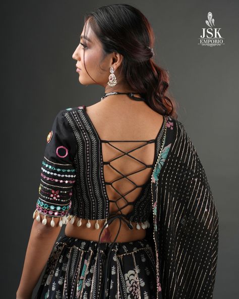 It's all in the details! From the laced back, to the beautifully embellished blouse sleeves, flowing dupatta, and playful latkans — this black Chaniya Choli from our Navratri Collection 2024 is a work of art in every stitch.

#JSKEmporio #FestiveWear #festivecollection2024 #festivecollection #FestiveFashion #Newcollection #Traditional #navratricollection #navratrichaniyacholi #chaniyacholicollection #TrendingDesigns #blackchaniyacholi #navratricollection2024 #blouse #chaniyadesign #GarbaLook Luxury Semi-stitched Blouse For Navratri, Semi-stitched Chinon Blouse For Navratri, Navratri Black Self-design Blouse Piece, Navratri Designer Blouse With Printed Motifs, Black Self-design Blouse For Navratri, Navratri Blouse Designs, Chaniya Choli Designs Navratri, Black Chaniya Choli, Navratri Blouse