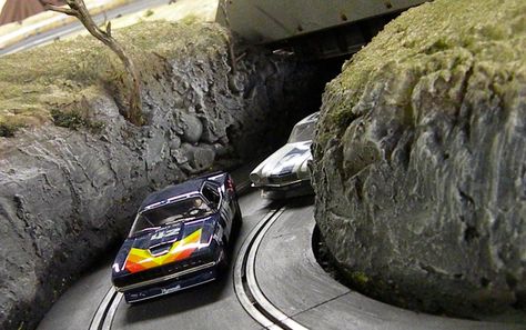 We have fond memories of slot car racing from our youth, but we never got to race on a course like this custom track found over at Pro-Touring.com with vintage racers and incredible detail, this is an adult's take on a youthful pastime. Slot Car Race Track, Model Diorama, Jack O'connell, Slot Racing, Slot Machine Cake, Race Tracks, Scenic Pictures, Machine Video, Slot Car Racing