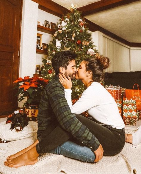 Couple Picture In Front Of Christmas Tree, Couple In Front Of Christmas Tree, Christmas Tree Poses Couple, Couple Christmas Tree Photos Indoor, Christmas Tree Photoshoot Couple, Couple Christmas Tree Photos, Christmas Tree Couple Pictures Indoor, Christmas Tree Couple Pictures, Christmas Couple Photoshoot Ideas