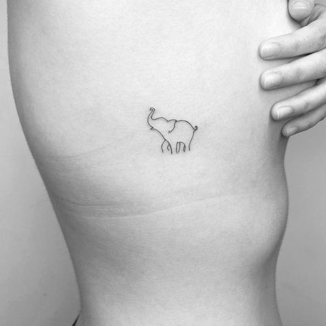 Minimalistic style elephant tattoo done in fine line. Joshua Tattoo, Simple Elephant Tattoo, Tiny Elephant Tattoo, International Tattoo, Africa Tattoos, Traditional Tattoo Designs, Elephant Tattoo Design, Handpoke Tattoo, Strength Tattoo