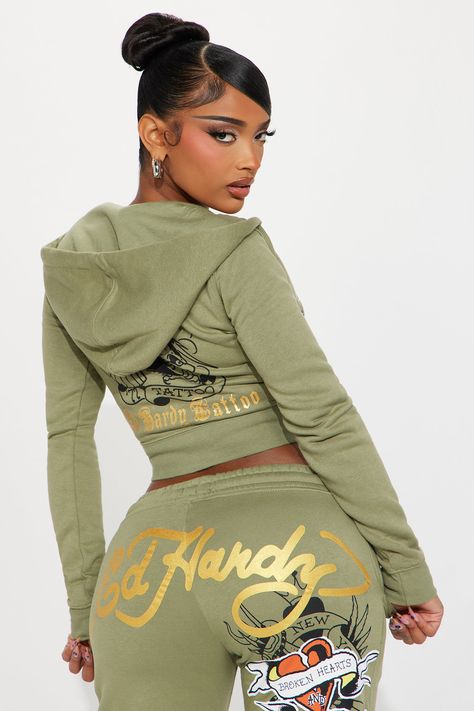 Available In Sage. Hoodie Front Zip Long Sleeve Front And Back Screen Ed Hardy Graphic Stretch Pair To "Ed Hardy Broken Hearts Pant" Disclaimer: Due To The Printing Process A Difference In Saturation May Occur. Each Garment Is Unique. 55% Cotton 45% Polyester Imported | Ed Hardy Broken Hearts Zip Front Hoodie in Sage size Small by Fashion Nova Cute Swag Outfits For Women, Ed Hardy Sweatsuit, Trapstar Jacket Women, Japanese Streetwear Women Tokyo Fashion, Nba Game Outfit Woman Winter, Women’s Streetwear, Ed Hardy Set, Ed Hardy Tracksuit, Baddie Must Haves