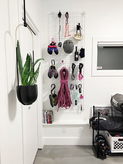 Climbing gear grid-wall organization system Hiking Gear Peg Board, Gym Gear Organization, Diy Gear Wall, Climbing Gear Aesthetic, Climbing Equipment Storage, Climbing Gear Wall, Gear Storage Wall, Climbing Organization, Climbing Gear Rack