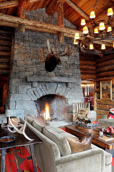 Cozy ski lodge retreat boasting rustic elegance in Big Sky Ski Lodge Living Room, Ski Lodge Fireplace, Rustic Ski Lodge, Lodge Fireplace, Cozy Ski Lodge, Lodge Living Room, Winter Lodge, Cabin Fireplace, Lodge Design