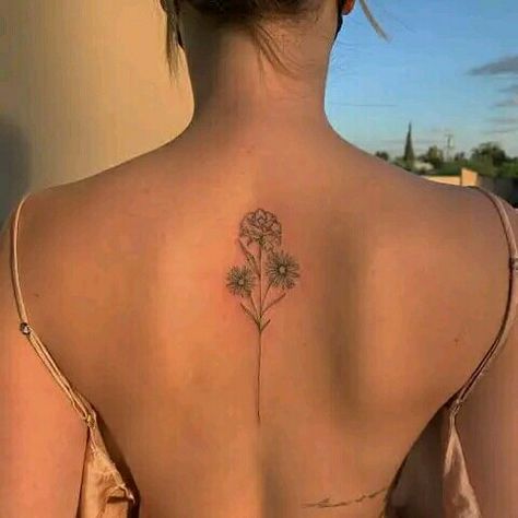 Back tattoo ideas for women Flower Bouquet Tattoo On Spine, Flower Spine Tattoos Simple, Carnation Tattoo Spine, Fine Like Spine Tattoo, Upper Back Flower Tattoo Women, Simple Line Spine Tattoo, Minimalist Back Tattoo Women Spine, Dainty Flower Back Tattoo, Medium Size Back Tattoos