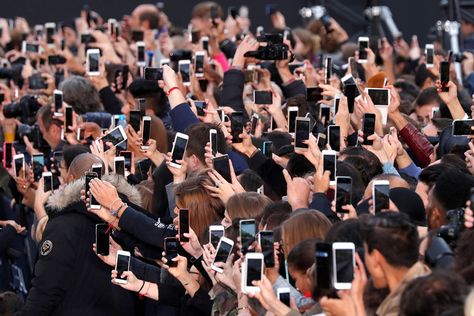 Modern Life: The Ubiquity of Smartphones - People use their smartphones to take photos of the L'Oreal fashion show on Champs Elysees Avenue during Paris Fashion Week (Charles Platiau /Reuters/Atlantic) Smartphone Art, Cell Phone Radiation, Smartphone Hacks, Marketing Presentation, Online Organization, Smartphone Photography, World Economic Forum, Smartphone Wallpaper, Jeddah