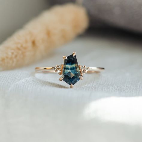 Asymmetric ring with Teal Sapphire, Sapphire and diamond cluster ring in Rose gold 14K Asymmetrical Rings, Asymmetric Ring, Blue Green Sapphire Ring, Asymmetrical Ring, Blue Green Sapphires, Teal Sapphire, Green Sapphire, Diamond Cluster Ring, Sapphire Jewelry