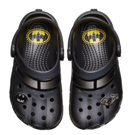 Imagine a pair of Crocs that zoom straight out of Gotham City, specially designed for the smallest superheroes. These kids Batmobile-inspired Crocs are a miniature marvel, with sleek black silhouettes that echo the iconic vehicle's vibe. The rugged, tire-tread soles are ready to conquer any playground, while the Bat-symbol charm on the strap adds a touch of heroic flair. Perfect for little feet ready to save the day, these Crocs are as cool and comfy as they are crime-fighting! The Batman Batmobile, Wip Bag, Batman Batmobile, Batman Kids, Men's Beanies, Toddler Sandals, Sneaker Sale, Crocs Classic Clogs, The Dark Knight