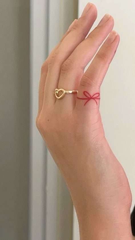 Red Tie Tattoo, Red Ribbon Finger Tattoo, Finger Ribbon Tattoo, Red Ink Tattoos Words, Red Pinky Tattoo, Red String Finger Tattoo, Cute Red Ink Tattoos, Red Ribbon Of Fate Tattoo, Red Line Of Fate Tattoo