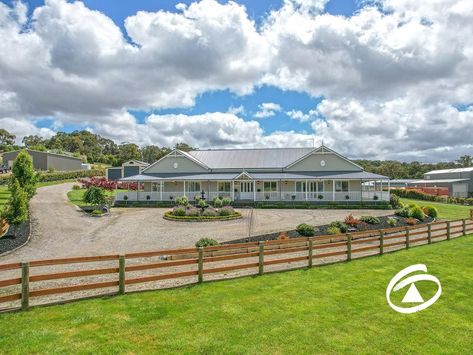 Presented on a fully landscaped 8000m2 allotment (2 Acres) this enviable lifestyle retreat is the result of meticulous planning and an overarching vision of excellence by the owners. Located within the highly regarded Ravendene Estate the property has been finished to the highest standard, with a critical eye to the smallest detail.Arriving at the security coded driveway entry it quickly becomes apparent that this is something special. The residence, a Harkaway Home,will captivate on f Acerage Homes, Built In Wet Bar, Dream Barn Stables, Queenslander House, Australian Country, Hamptons Style Homes, Australia House, Ranch Remodel, Timber Deck