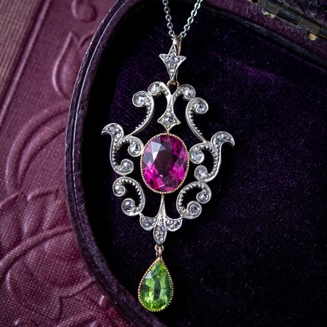 Stunning! 🌷 This incredible Suffragette piece is new in at Laurelle A beautiful antique Edwardian Suffragette pendant adorned with a pear-cut peridot dropper (approx. 1ct) and a central oval-cut tourmaline with a deep pink hue (approx. 3ct). The gallery has a fabulous Art Nouveau design with scrolling, foliate motifs decorated with twinkling rose-cut diamonds (approx. 0.34ct total). Jewellery displaying the colours green, violet and white were often worn in support of the Women’s Social a... Edwardian Suffragette, Suffragette Jewellery, Suffrage Movement, Edwardian Engagement Ring, Arm Art, Platinum Chain, Edwardian Jewelry, Pretty Accessories, Art Nouveau Design