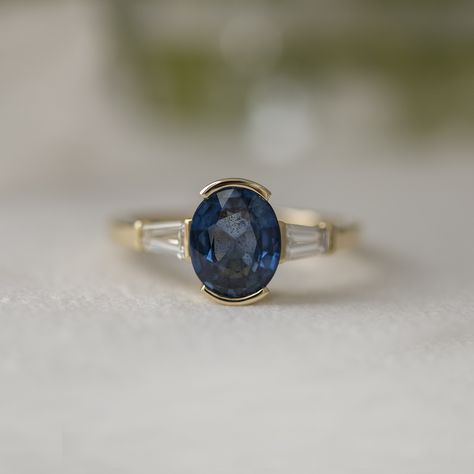 Custom half-bezel three-stone ring for Hannah! We repurposed her gold from a couple of sentimental family wedding bands, and she sourced the sapphire herself. We added a couple of lab-grown diamonds for a classic, Art Deco look! 💙 Saphire Engament Ring Bezel, Bezel Set Sapphire Engagement Ring, Bezel Set Sapphire Ring, Bezel Sapphire Ring, Bezel Sapphire Engagement Ring, Art Deco Sapphire Ring, Half Bezel, Bezel Engagement Ring, Round Sapphire