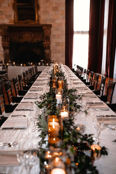 Wedding Greenery And Candles, Wedding Table Settings Long Tables, Christmas Wedding In Florida, Black Chairs Wedding Reception, Dover Hall Estate Wedding, Winter Wedding Place Settings, Wedding Black Chairs, Black And Greenery Wedding, Candles At Wedding